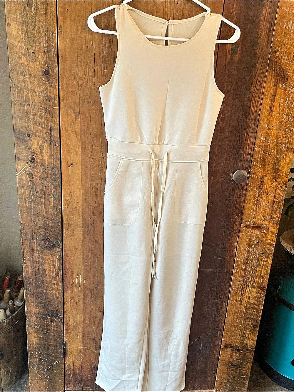 Sleeveless Jumpsuit in beige. New